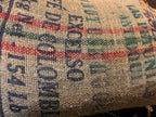 Full hessian sack of unroasted green coffee beans, specialty-grade raw beans ideal for home roasting or wholesale supply.